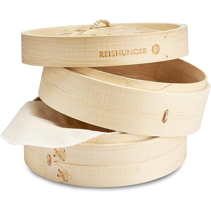 Elevate your culinary experiences with the Reishurger Bamboo Steamer, an exquisitely handcrafted kitchen essential made from premium, sustainable bamboo. This authentic steamer boasts a classically inspired dual-tier design, each level spanning a convenient 8 inches—ideal for simultaneously cooking a medley of dishes.