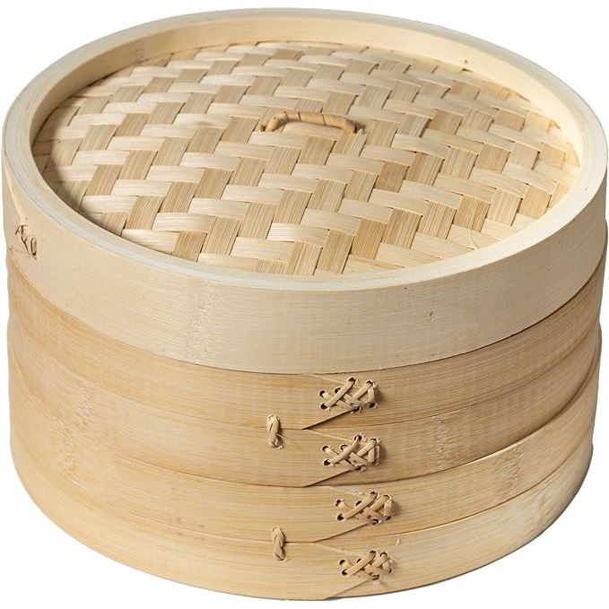 Elevate your culinary prowess with the Joyce Chen 2-Tier Bamboo Steamer Baskets, an essential tool for health-conscious chefs and enthusiasts alike.