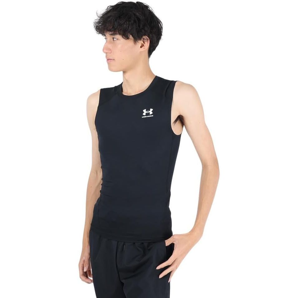 The Under Armour men's Armour HeatGear Compression Sleeveless T-Shirt is a performance-driven piece of activewear designed to enhance your workout experience. Made from polyester and elastane, this compression shirt is lightweight, stretchy, and breathable, providing a snug and supportive fit that helps improve blood flow and muscle efficiency.