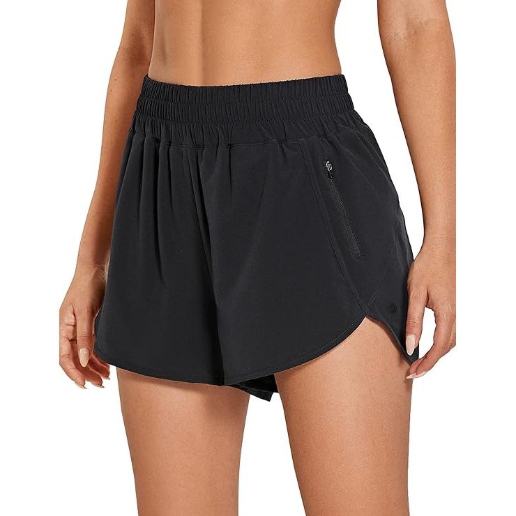 The CRZ YOGA Women's High Waisted Running Shorts with Mesh Liner are designed for comfort and performance during workouts and activities. The high-waisted design provides a secure and flattering fit, while the mesh liner offers breathability and support. These shorts have a 3-inch inseam and a dolphin cut for a comfortable and stylish look.