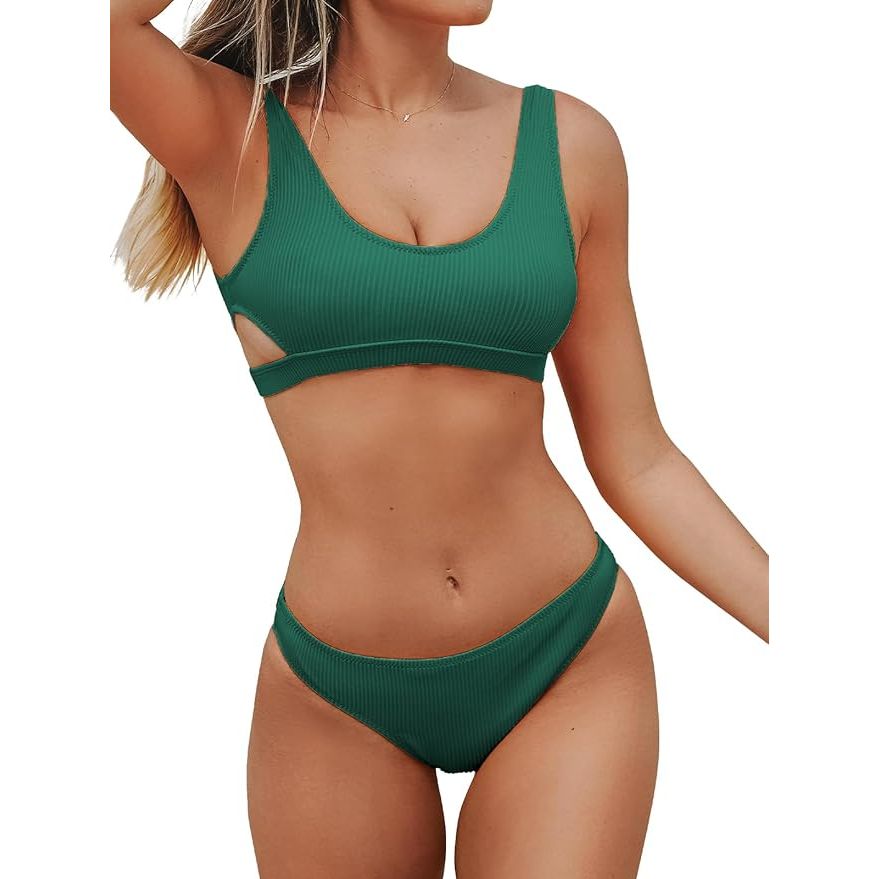 The tank top-style top provides good coverage and support, while the side cutouts add a fun and fashionable touch. The mid-rise bottom offers moderate coverage and is designed to stay in place while swimming or lounging. The ribbed texture adds a touch of sophistication to the overall look of the swimsuit, making it a versatile option for various occasions.