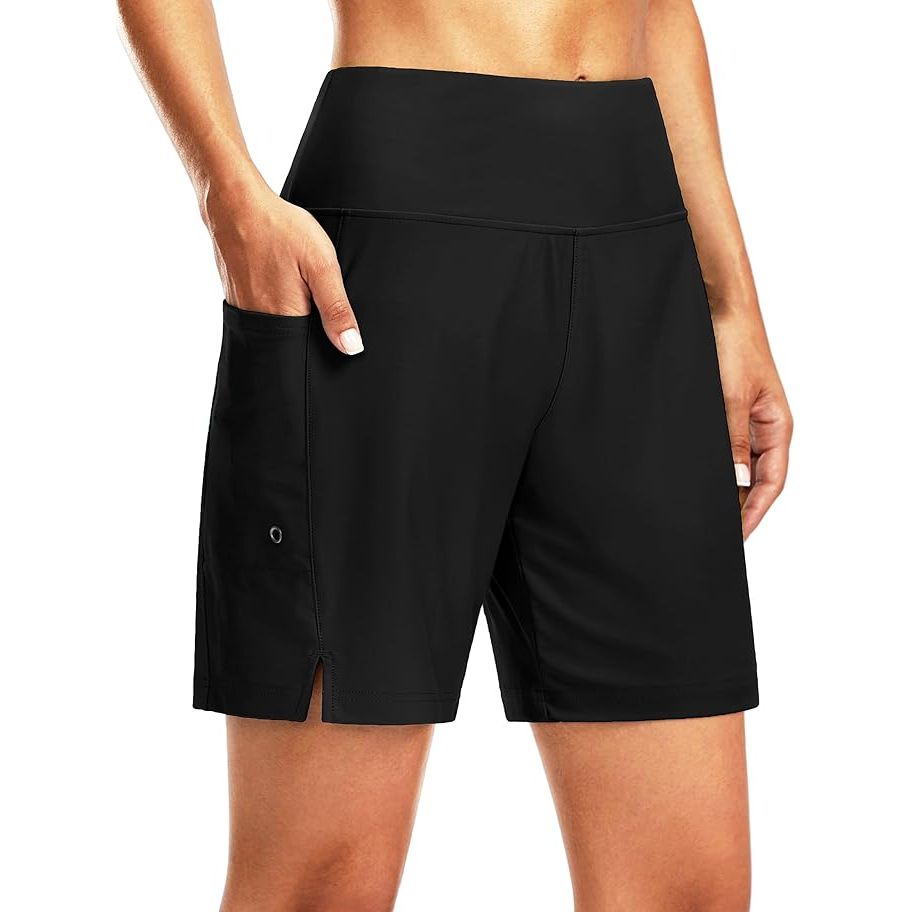 The G Gradual Women's 7" Long Swim Board Shorts are high-waisted swim shorts designed for women. These quick-dry shorts are perfect for beach activities and swimming. They feature a comfortable liner and pockets for storing essentials.