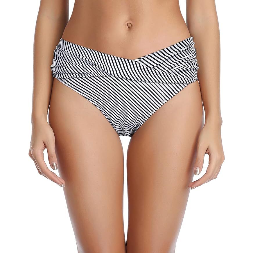 The Tempt Me Women Twist Bikini Bottom is a trendy and flattering swimsuit bottom for women. It features a twist design at the front that adds a stylish touch to the overall look. The moderate coverage and high cut design create a leg-lengthening effect, while the ruched detailing enhances the shape of the bottom.