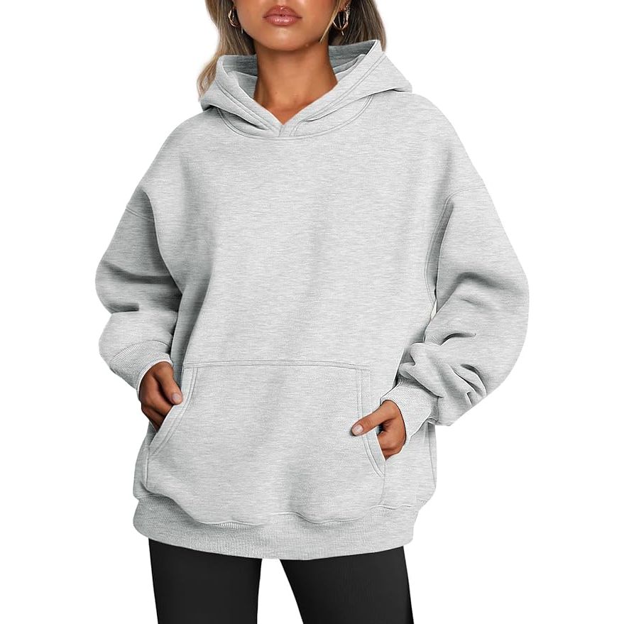 The Trendy Queen Women's Oversized Hoodie is a fashionable and comfortable choice for chilly fall days. Made from soft fleece material, this pullover sweatshirt features a long sleeve design and a cozy hood to keep you warm. The oversize fit adds a stylish and relaxed touch to your outfit, making it perfect for lounging at home or running errands.