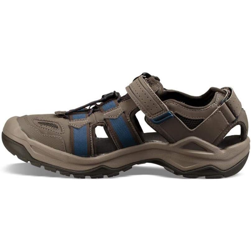 The Teva Men's M Omnium 2 Sport Sandal is a versatile and durable outdoor sandal perfect for hiking, water sports, and other outdoor activities. It features a quick-drying synthetic upper and a closed-toe design to protect your toes from rocks and debris.