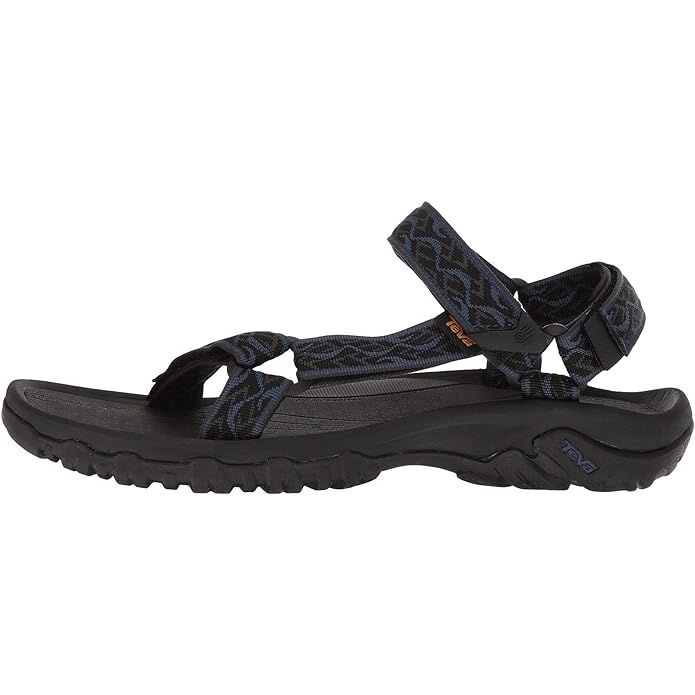 The Teva Men's Hurricane 4 is a popular sandal designed for outdoor adventures and water activities. It features a durable polyester webbing upper that is quick-drying and adjustable for a secure fit. The sandal also has a cushioned Shoc Pad in the heel for added comfort and shock absorption.