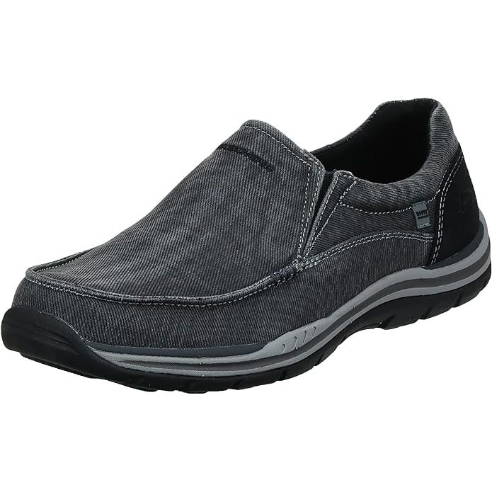 Skechers Men's Expected Avillo Relaxed-Fit Slip-On Loafer is a casual and comfortable shoe designed for everyday wear. Made with a soft washed canvas fabric upper, this loafer features a relaxed fit design for a roomy and comfortable feel.