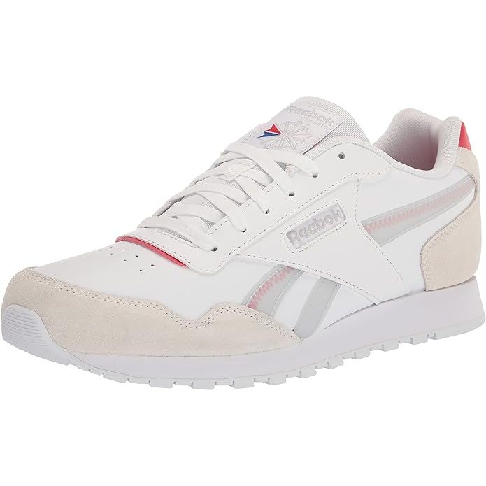 The Reebok Men's Classic Harman Run Sneaker is a timeless and versatile shoe that combines style and comfort. This sneaker features a low-cut design for a sleek and modern look, making it perfect for everyday wear. It is made with a leather upper that provides durability and support, while the cushioned foam midsole offers all-day comfort.