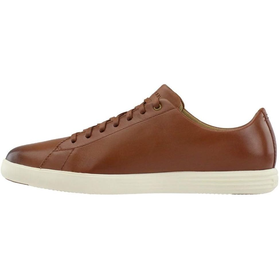 Cole Haan Men's Grand Crosscourt Sneaker is a stylish and versatile shoe suitable for casual or athleisure wear. It is designed with a sleek and modern silhouette, featuring a classic lace-up closure and a comfortable cushioned insole. The sneaker is crafted with premium materials such as leather or suede, giving it a high-quality look and feel.