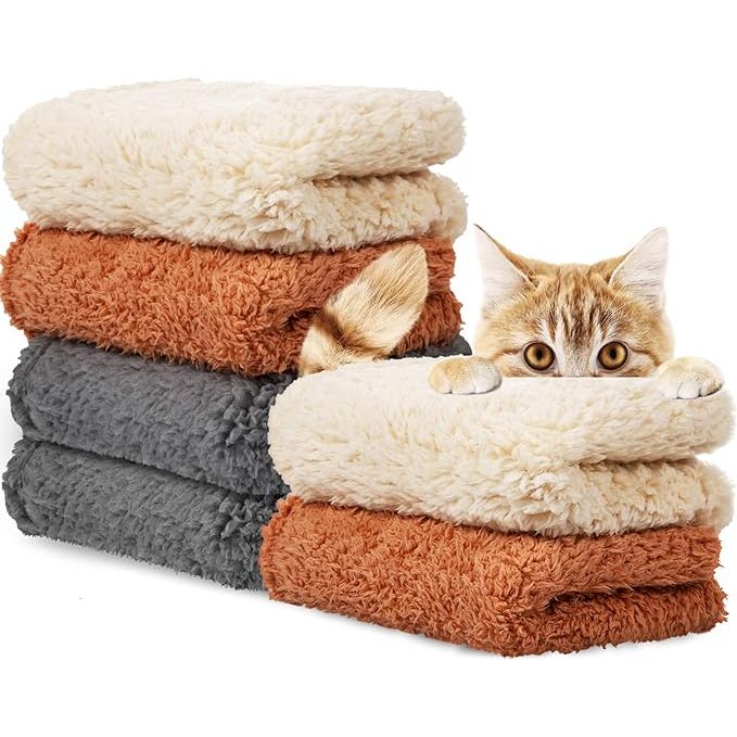 The Newwiee 6 Pcs Calming Blankets are designed for small to medium-sized dogs and cats to provide them with a soft and warm blanket for comfort and relaxation. These blankets are made of fluffy fleece, creating a cozy and soothing environment for pets to snuggle up in.