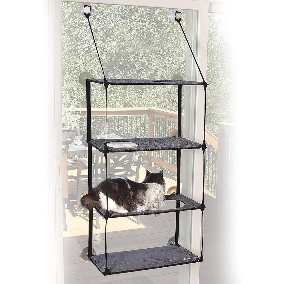 The K&H Pet Products EZ Mount Window Sill Cat Bed is a convenient and space-saving bed for your feline friend. It is designed to easily attach to any window with the included suction cups, providing your cat with a cozy spot to relax and nap while enjoying the view outside. The bed is made of sturdy materials and can support large cats comfortably.