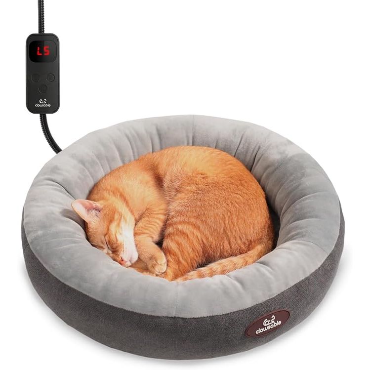 Introducing the ultimate haven for your feline friend - the Dreamy Donut Design Cat Bed. Crafted with a snuggle-worthy donut shape and velvety plush material, this cat bed cradles your pet in pure comfort. The adjustable heating pad adds an extra level of coziness, perfect for chilly days or your cat's preference.