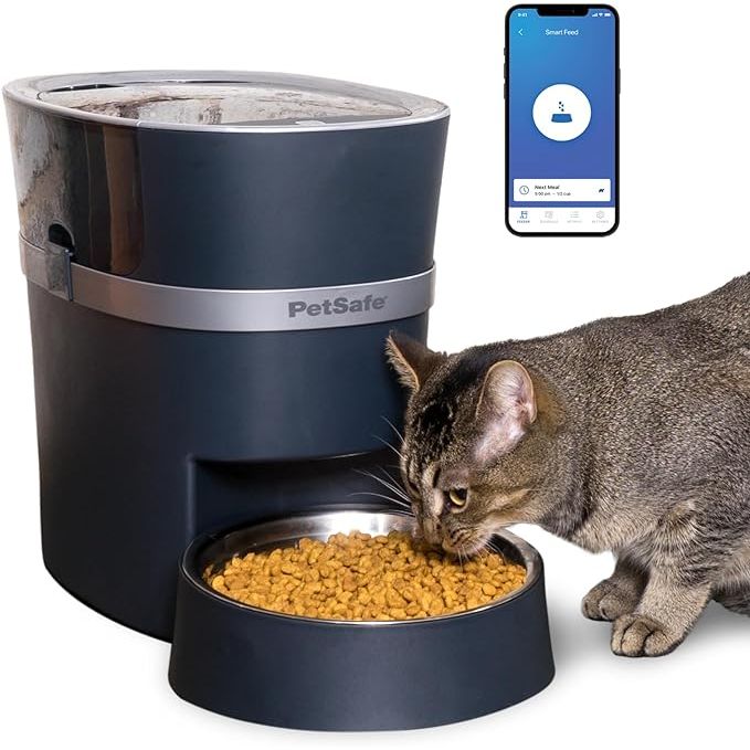 The PetSafe Smart Feed is an electronic pet feeder designed for both cats and dogs. It has a large capacity of 6 liters or 24 cups, making it suitable for households with multiple pets or larger breeds. The feeder allows pet owners to program meal times and portion sizes to ensure their pets are fed consistently and on time.