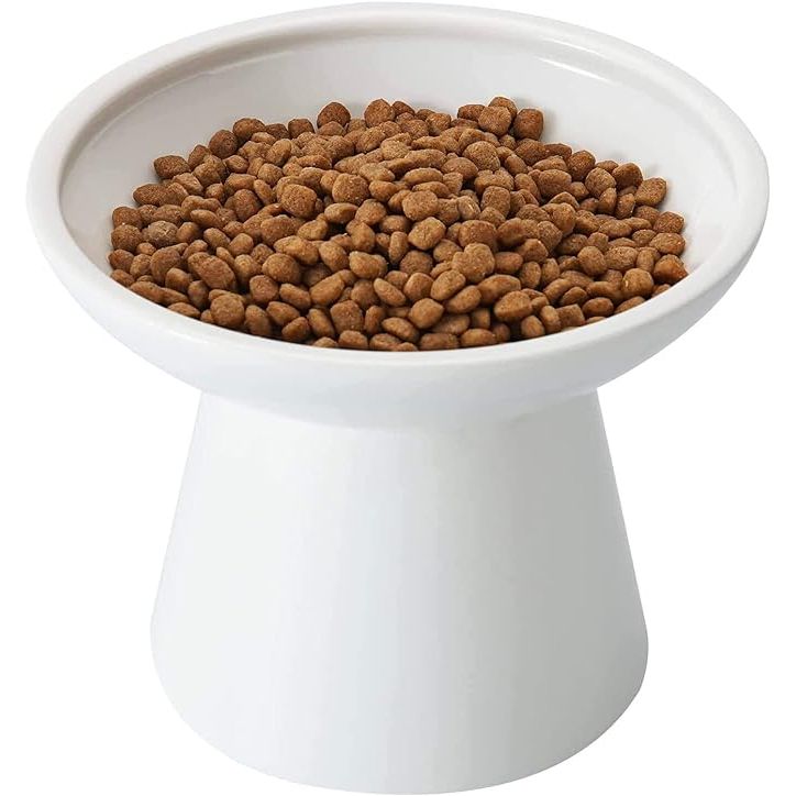 The Whisker-Friendly Elevated Cat Bowl is designed with your feline friend in mind, featuring an extra wide and shallow shape that prevents whisker fatigue. The sturdy and durable ceramic material ensures that this bowl won't tip over and is resistant to bacteria buildup.