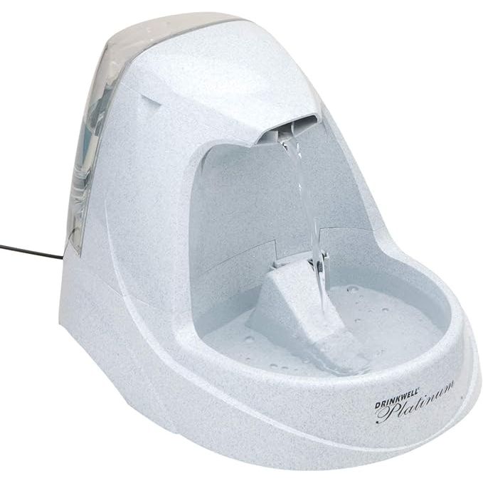 The PetSafe Drinkwell Platinum Dog and Cat Water Fountain is an automatic drinking fountain designed for pets. It has a capacity of 168 ounces and is ideal for both dogs and cats. The fountain features a free-falling stream of water that entices pets to drink more, promoting hydration and overall health.