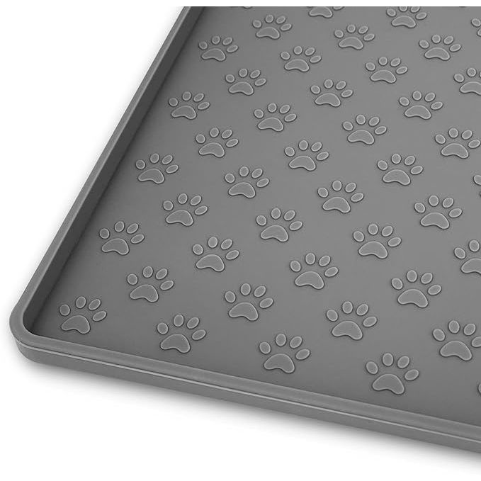 The Ptlom Pet Placemat is a durable silicone mat designed for both dogs and cats to prevent food and water overflow during meal times. Measuring at 18 inches by 12 inches, this mat is suitable for small, medium, and big pets, making it versatile and ideal for multi-pet households.