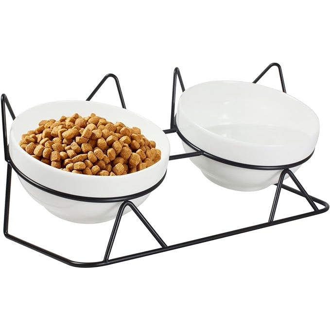 Elevated tilted cat bowls are specifically designed to improve the dining experience for indoor cats by elevating the food and water bowls at a 15° angle. This elevated design reduces the strain on the cat's neck and joints while eating and drinking, making it more comfortable for them to consume their food.