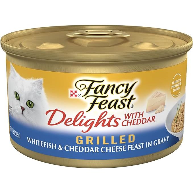 Purina Fancy Feast Delights with Cheddar Grilled Whitefish and Cheddar Feast in Wet Cat Food Gravy is a premium cat food designed to satisfy your feline friend's taste buds. This pack contains 24 cans, each weighing 3 ounces, ensuring your cat has a steady supply of delicious and nutritious food.