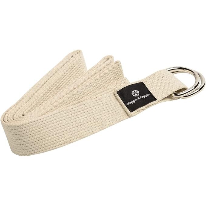 Hugger Mugger D-Ring Cotton Yoga Strap is made of super strong cotton material with a metal D-ring buckle for added durability and stability during yoga practice. The cotton material is soft and comfortable against the skin, making it ideal for stretches and poses.