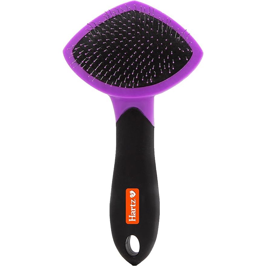 The Hartz Groomer's Best Small Slicker Brush is a grooming tool designed for cats and small dogs. It features fine wire bristles that are gentle on your pet's skin and coat, making it perfect for daily grooming and brushing. The brush is designed to remove loose fur, dirt, and tangles, leaving your pet's coat looking shiny and healthy.