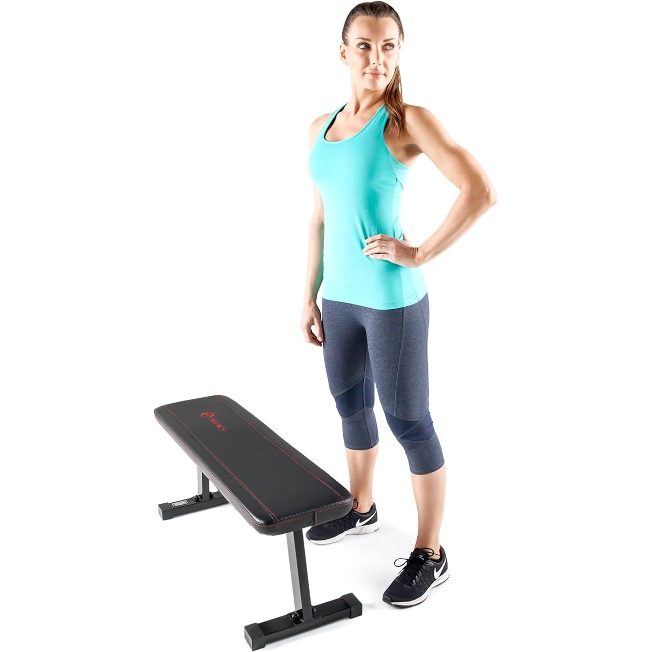 The Marcy Flat Utility Weight Bench is a versatile piece of equipment designed for home gym weight training and ab exercises. It features a durable steel frame with a powder-coated finish, providing a stable and sturdy platform for your workouts. The bench has a compact design that is ideal for small spaces and can easily be stored when not in use.