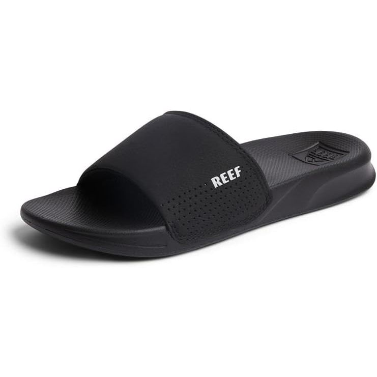 The Reef Men's One Slide is a classic, no-frills slide sandal that offers both comfort and style. Made with a synthetic nubuck upper and a soft cushioned footbed, this shoe is perfect for everyday wear. The slide design makes it easy to slip on and off, making it a convenient choice for quick trips to the beach or running errands.