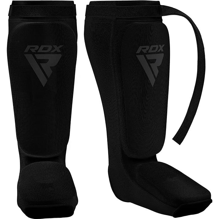 RDX Shin Guards are specially designed for kickboxing, Muay Thai, MMA, and various other martial arts. They are made with high-quality materials and are SATRA approved, ensuring they meet industry standards for safety and performance. These shin guards provide excellent protection for the legs and insteps during sparring and training sessions.