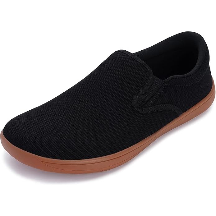 The WHITIN Men's wide slip-on barefoot shoes are minimalist sneakers designed for a natural and comfortable walking experience. These shoes feature an elastic collar that allows for easy entry and a secure fit, making them convenient for everyday wear.
