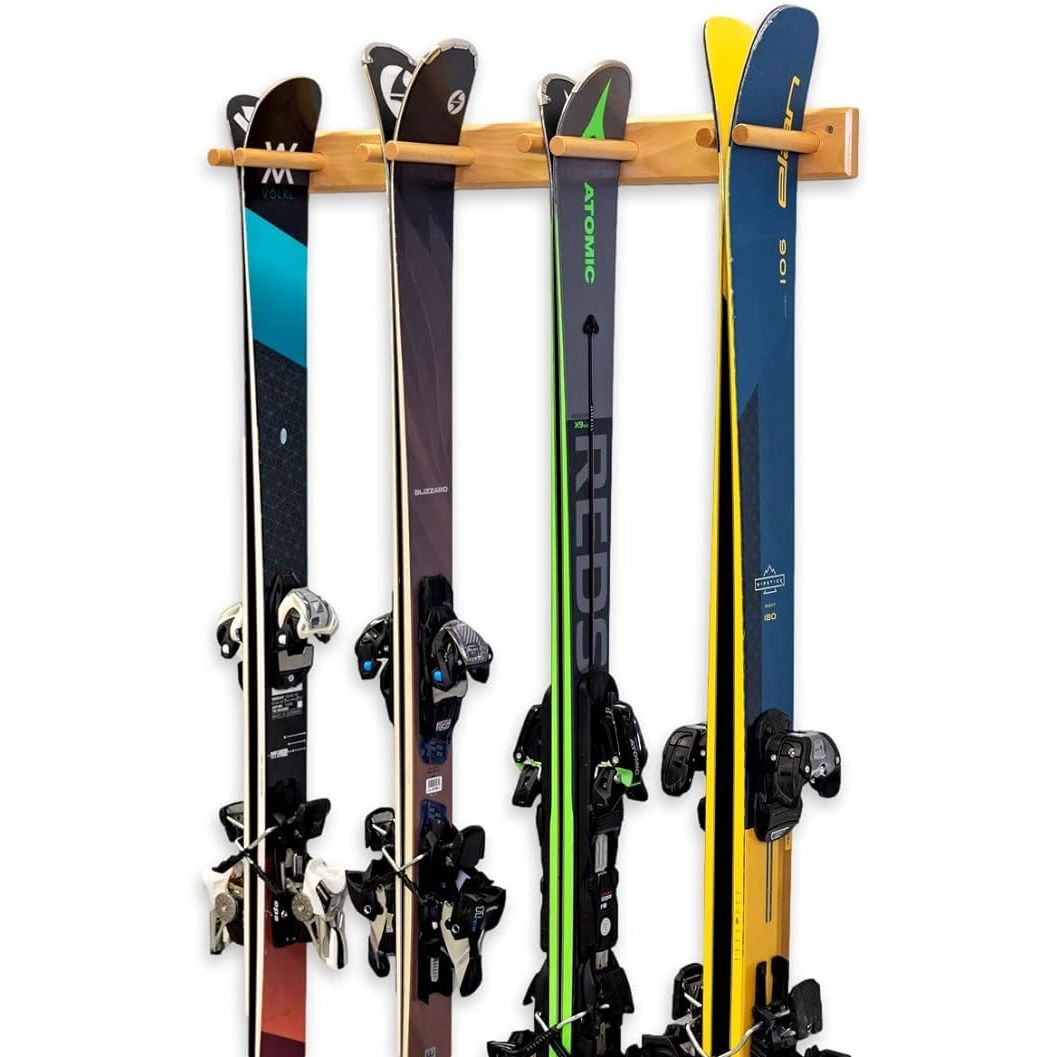 The StoreYourBoard Timber Ski Wall Rack is a storage solution designed to safely and securely hold up to 4 pairs of skis. Made from natural wood, this rack is a stylish addition to any home or garage. The sturdy construction ensures that your skis are kept off the ground and organized, reducing clutter and protecting your equipment.