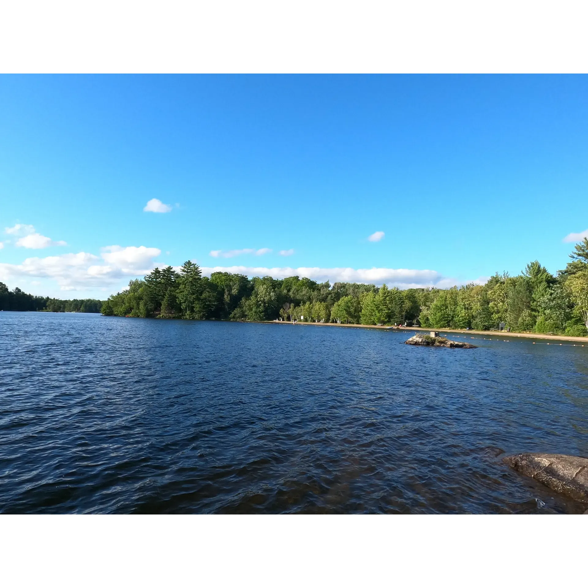 Oastler Lake Provincial Park is a breathtaking outdoor retreat boasting pristine campsites and an awe-inspiring lake that captivates visitors with its serene beauty. Guests can bask in the warmth of the region's hospitality, as they are greeted by exceptionally friendly park goers and staff, ensuring a welcoming atmosphere for all. This gem of a park is an ideal setting for camping enthusiasts looking to create cherished memories in the great outdoors.

The sublime campground is complemented by a picturesque lake that serves as the heart of the park. It offers not only visual splendor but also a range of recreational activities. Canoeing enthusiasts can take to the tranquil waters, with rentals readily available, inviting explorers to glide along the surface and take in the park's natural charm.

With convenience in mind, the park is situated a stone's throw away from the charming town of Parry Sound, providing visitors with easy access to a variety of amenities. Whether you're looking to dine out at excellent restaurants, gather supplies from grocery stores, indulge in a leisurely golf session, or cozy up with a coffee, all can be found within close proximity.

Oastler Lake Provincial Park is also a haven for beach-goers, boasting a splendid shore that is perfect for both leisurely strolls and refreshing dips in the clear shallow waters, making it particularly suitable for families with children. The park maintains a sense of tranquility, allowing guests to truly unwind and relish the natural surroundings.

A stay at this enchanting campsite offers a unique opportunity to admire the night sky. Star gazers can revel in the magnificent celestial displays, with the beach providing a perfect backdrop for an unforgettable stargazing experience.

For those who favor the company of their four-legged friends, the park features a sizeable off-leash dog beach, ensuring that every member of the family gets to enjoy the natural beauty of the area.

The park's layout promotes a close-knit community feel, with easily accessible areas that ensure everything is just a short walk away. Furthermore, its proximity to downtown Parry Sound ensures that convenience is at your fingertips, all while enjoying the solace and beauty of Oastler Lake Provincial Park.

Visitors highlight the very nature of the park as an inviting and peaceful retreat. With sparkling waterways, excellent facilities, and a plethora of activities within easy reach, this park stands out as a must-visit destination for those seeking a tranquil escape and the joys of outdoor living. Description by ChatGPT.