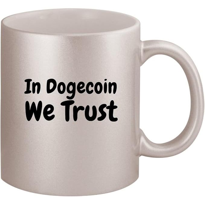 The "In Dogecoin We Trust" ceramic 11oz silver coffee mug features a playful and modern design highlighting the popular cryptocurrency Dogecoin. The mug is made from high-quality ceramic material that is both durable and dishwasher safe, making it an ideal choice for everyday use. The silver finish adds a sleek and stylish touch to this unique mug.