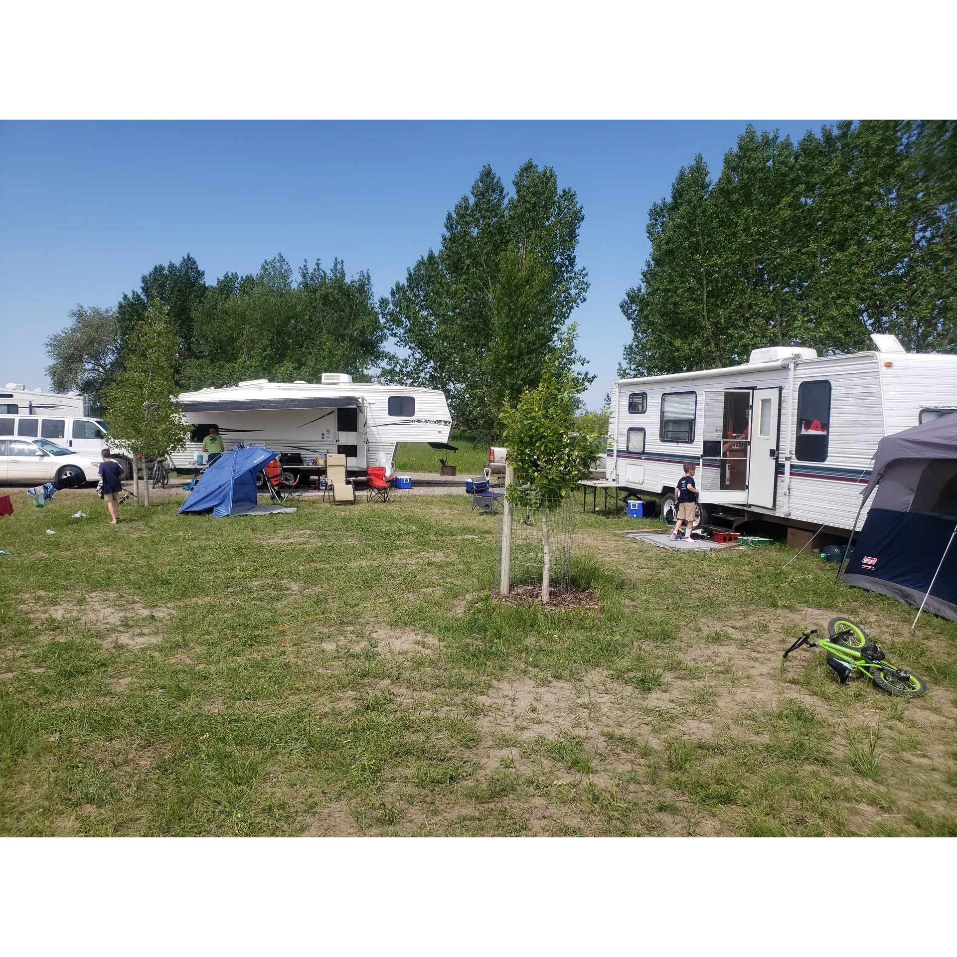 Surrounded by natural beauty, Wally's Beach Campground offers an idyllic retreat for outdoor enthusiasts and beachgoers alike. Visitors are greeted by the breathtaking view of a forest that boasts exceptional beauty, providing a scenic backdrop for a day of relaxation or exploration. The campground itself has undergone significant improvements, with new, modern washroom facilities enhancing the comfort of guests during their stay.

The beach adjacent to Wally's Beach Campground is a slice of paradise, with incredibly soft sand that's a pleasure to walk on. It's an inviting space for sun worshippers to bask in the warmth and for families to enjoy a splendid day out. Pet owners will be delighted to know that the area is dog-friendly, making it an excellent location for a stroll with your furry friend, while the presence of gulls and waterfowl adds to the natural ambiance of the setting.

Contributing to an accessible and trouble-free visit, the campground features well-maintained roads throughout. Although the lake experiences natural fluctuations with water levels and conditions, the picturesque location offers space for picnics and leisurely outdoor activities. While enjoying the beauty of Wally's Beach Campground, visitors can appreciate the beauty of the surrounding water bodies and the tranquil environment that it provides. 

Overall, the blend of recently upgraded facilities, the allure of the forest, and the pristine beach make Wally's Beach Campground a notable destination for those looking to escape to nature and savor the great outdoors. Description by ChatGPT.