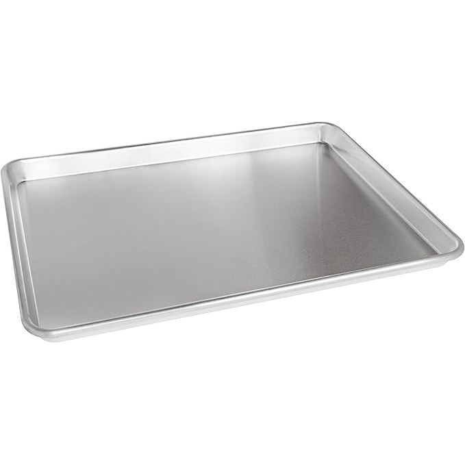 Fat Daddio's SP-HALF Natural Aluminum Half Sheet Pan is a high-quality baking accessory designed for both professional bakers and home cooks. This half sheet pan measures 18 x 13 inches, making it ideal for baking cookies, pastries, and other baked goods.