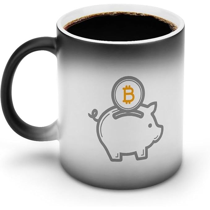 The Bitcoin Piggy Bank Color Changing Coffee Mug is a unique and fun way to enjoy your hot beverages. This magic mug is heat-sensitive, meaning that when you pour a hot liquid into it, the design on the mug changes color.