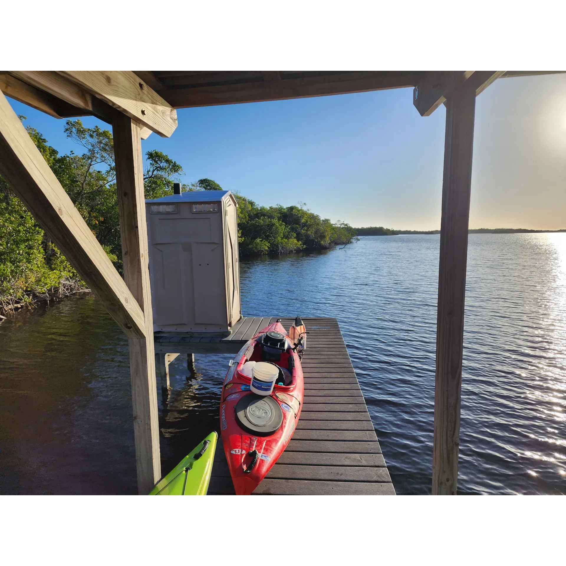 Lane Bay Chickee offers a tranquil escape for outdoor enthusiasts seeking a serene camping experience in the heart of the Everglades. Renowned for its picturesque landscapes, this destination is a prime spot for seasoned paddlers and anglers. Anticipate an exciting challenge as you navigate your way through the beautiful maze of mangroves, where adequate preparation with maps or GPS enhances the adventure, ensuring a safe and rewarding arrival at this secluded oasis.

Upon reaching Lane Bay Chickee, you'll be greeted by the pristine calmness of its waters, suitable for kayaking and canoeing. With depths ranging around 2-3 feet, access to the site is straightforward for those making their journey by water. The facility includes convenient features such as ladders and posts which greatly facilitate ascending onto the chickee with your kayak.

Fishing enthusiasts can look forward to an exhilarating experience, with opportunities to catch bull sharks and catfish directly from the platform — a highlight for many visitors. The chickee's location offers solace from the hustle of everyday life, with the silence and tranquility of nature enveloping you in the most peaceful surroundings imaginable.

For those who seek a more extended stay, pitching a tent on the deck provides a memorable overnight adventure amidst the wild, untouched settings of the Everglades. Embrace the rush of self-sufficiency and freedom on the water, with manageable preparation and insights from experienced explorers ready to share their tips, including practical advice on fuel consumption for those considering motorboats.

While visiting Lane Bay Chickee, you’ll find it ideally positioned to capture refreshing southern winds — a welcome natural relief during warmer months. The site's thoughtful reconstruction ensures that contemporary visitors can enjoy enhanced facilities without compromising the rustic charm and intimate connection with nature that defines this exceptional camping destination. Whether for a few hours or a few days, Lane Bay Chickee stands out as an unforgettable retreat where every moment is a brushstroke in the masterpiece of the Everglades' landscape. Description by ChatGPT.