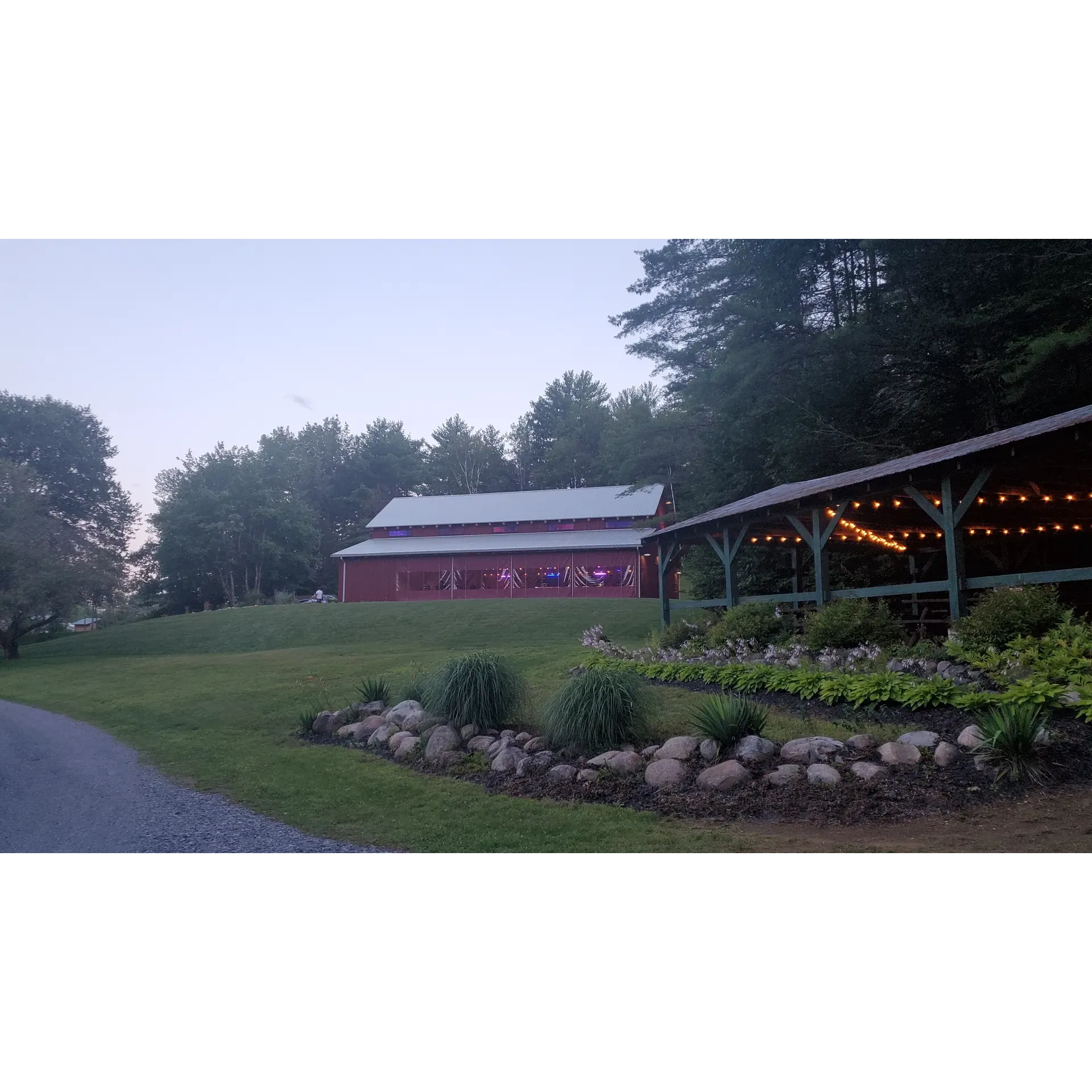 Rustic Barn Campground offers campers a serene and picturesque outdoor retreat, perfect for reconnecting with nature without forsaking comfort. This charming oasis features a stunning landscape, complete with a large, tranquil pond and the iconic Rustic Barn, which provides a scenic backdrop that guests find delightful upon arrival.

Guest satisfaction is a priority at Rustic Barn Campground, as the owner, Matt, personally ensures that visitors are content with their campsite selections. His dedication to the campground is evident in the well-maintained facilities and immaculate grounds. The fresh, neatly graveled roads, trimmed trees, and professional landscaping affirm the high standards maintained throughout the property, contributing to its reputation as one of the finest private campgrounds in the region.

The campground delivers an unrivaled sense of peace and quiet, particularly under the starlit sky, offering campers a space where they can enjoy undisturbed rest. The sense of safety and the welcoming atmosphere created by both Matt and the community of seasoned campers add to the location's charm.

With a prime location close to the attractions of Saratoga Springs, guests have easy access to various activities while enjoying the seclusion that Rustic Barn Campground offers. Facilities such as full hookup utilities ensure a seamless camping experience, with sites featuring well-maintained power, water, and sewer systems. Spacious campsites, which easily accommodate campers and vehicles, include fire pits and sturdy picnic tables, facilitating idyllic outdoor dining and gatherings.

The campground is also home to a selection of modest yet inviting cabins that offer an alternative to traditional camping, providing options for different preferences and needs. While Rustic Barn Campground prides itself on the natural beauty and recreational opportunities it provides, guests looking to explore will find that it serves as the perfect base from which to embark on the diverse experiences available throughout Saratoga Springs.

Whether for a short trip or an extended holiday, Rustic Barn Campground is a favored destination for individuals and families alike. Many guests find themselves not only cherishing their stay but also eagerly planning their return, often with the prospect of sharing the experience with extended family and friends. Description by ChatGPT.