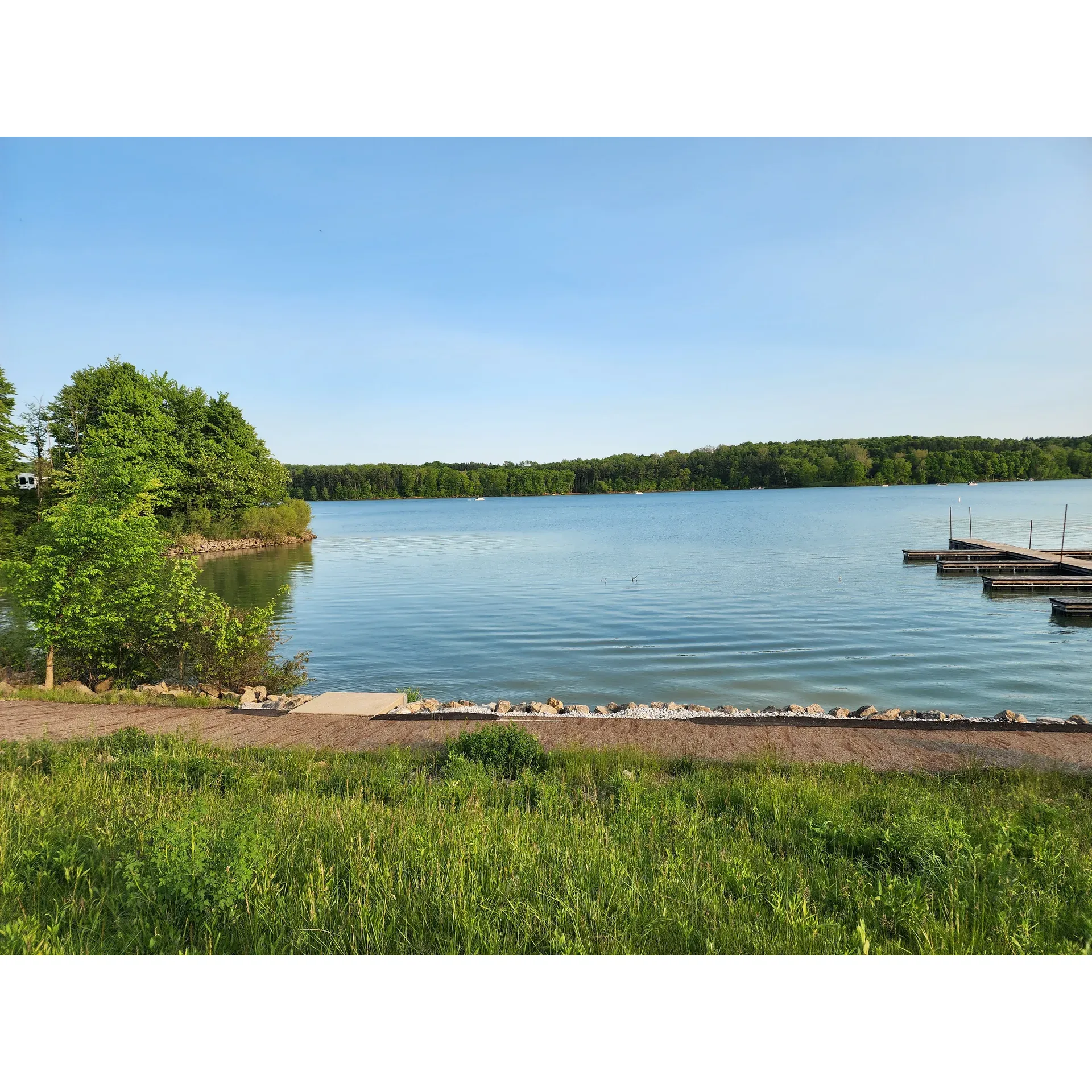 Atwood Lake Park is a perennial favorite for both new and returning visitors, celebrated for its meticulous upkeep and plethora of available campsites that cater to a variety of preferences. An outdoorsman's paradise, the park has become an annual tradition for hunting enthusiasts, who applaud the park's transformative growth and enhancements over the past decade. As an acclaimed destination in Ohio, Atwood Lake Park's picturesque landscape beckons, featuring the scenic allure of tranquil trails that draw in cyclists and nature lovers alike.

With a reputation for exceptional cleanliness, the park stands out as one of Ohio's premier camping grounds. Cyclists revel in the park's network of smooth, paved roads enveloped by natural beauty, while the shimmering lake provides a serene backdrop, dotted with leisurely pontoons and graceful sailboats. The park's calendar brims with organized activities, offering entertainment for both children and adults, alongside outdoor movie screenings and access to delectable, budget-friendly fare at the activity center.

Designed with convenience in mind, Atwood Lake Park features a harmonious layout that includes a variety of paths for walking, hiking, and biking, alongside designated fishing spots, boat ramps, and inviting beaches. Its family-friendly atmosphere is perfected by the ease of bringing pets along for the adventure. Even with the bustling presence of lively children, the park retains a quiet ambiance, allowing guests to indulge in the simple pleasures of relaxation, such as leisurely walks with pets or peaceful fishing excursions. Boasting sites that comfortably accommodate extended stays, visitors can immerse themselves in the tranquility of nature, just a short journey from home, for a truly rejuvenating experience. Description by ChatGPT.