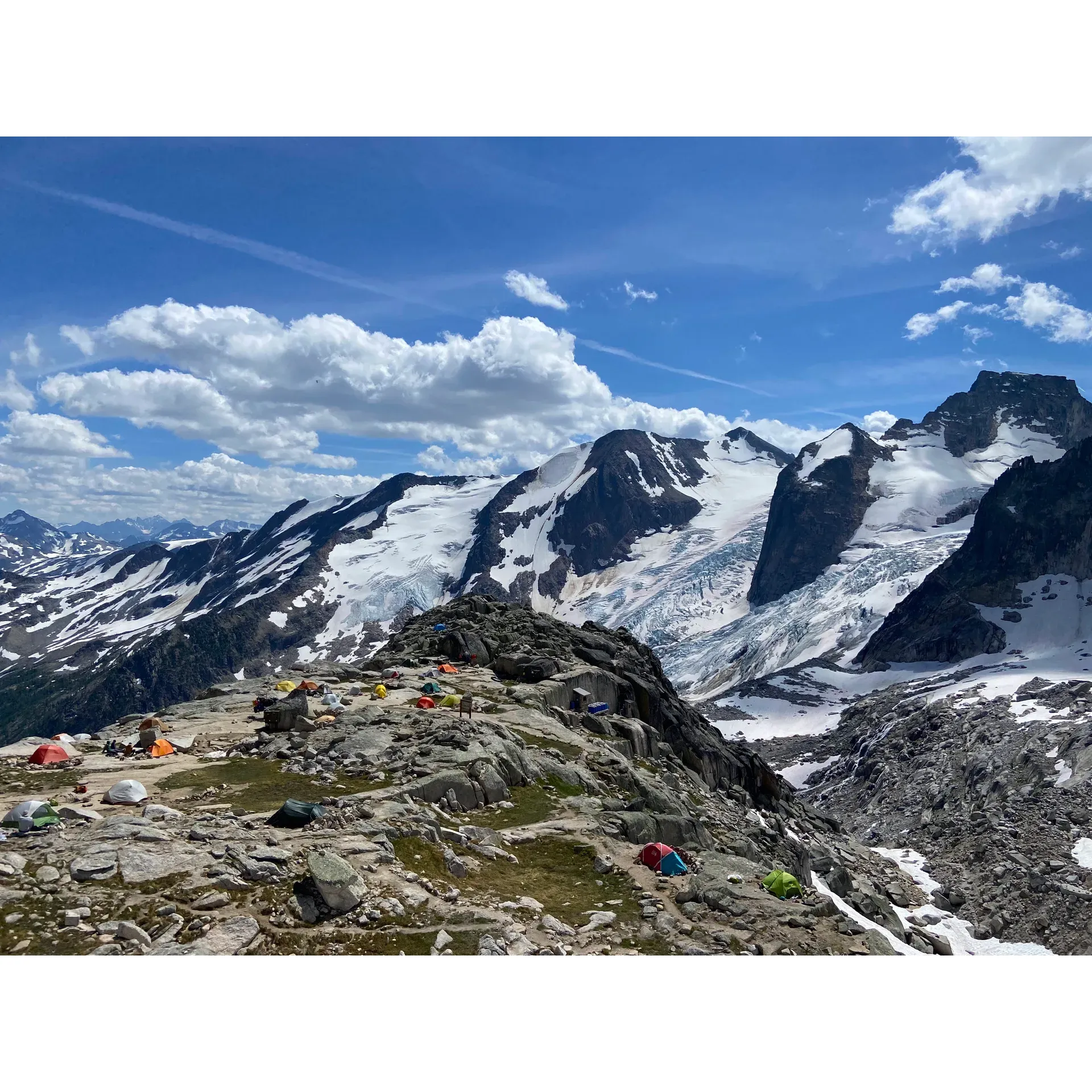 Experience the great outdoors at its finest at Applebee Dome, a pristine campground set amidst the breathtaking beauty of glaciers and towering mountain spires. This elevated oasis offers adventurers a unique 'free for all' camping experience on expansive rock slabs that let you connect with nature in an unstructured and organic way.

Prepare to immerse yourself in an adventurous climb as you take on the 2,400-meter ascent to reach this remarkable destination. The journey is a rewarding challenge, marked by an impressive elevation gain that calls for a spirit of endurance. Along the way, hiking sticks become essential companions, guiding you through the rugged terrain.

Applebee Dome is more than just a campsite; it's a community where likeminded outdoor enthusiasts gather. It's an ideal base camp for those looking to explore various climbing routes or to simply enjoy the solidarity of fun camping under the stars. The campground facilitates your adventure with conveniences like bear caches, a water station for treating your fill, and a grey water station for responsible waste management.

Camping at Applebee Dome is made seamless; you can easily pay your camping fee and secure your permit with the assistance of a friendly park ranger. With one outhouse at the trailhead and two more at the campground, the necessary amenities are in place to ensure your stay aligns with the ethos of preserving the natural splendor.

Applebee Dome encourages a 'Leave No Trace' philosophy, inviting you to capture memories with photographs while maintaining the integrity of the environment. Every step taken in this world-class area is not just a journey through wilderness, but a step towards more adventures that await your return. Whether ticking off a bucket list dream or seeking a regular escape into the mountains, Applebee Dome promises an experience that calls you back, time and again. Description by ChatGPT.