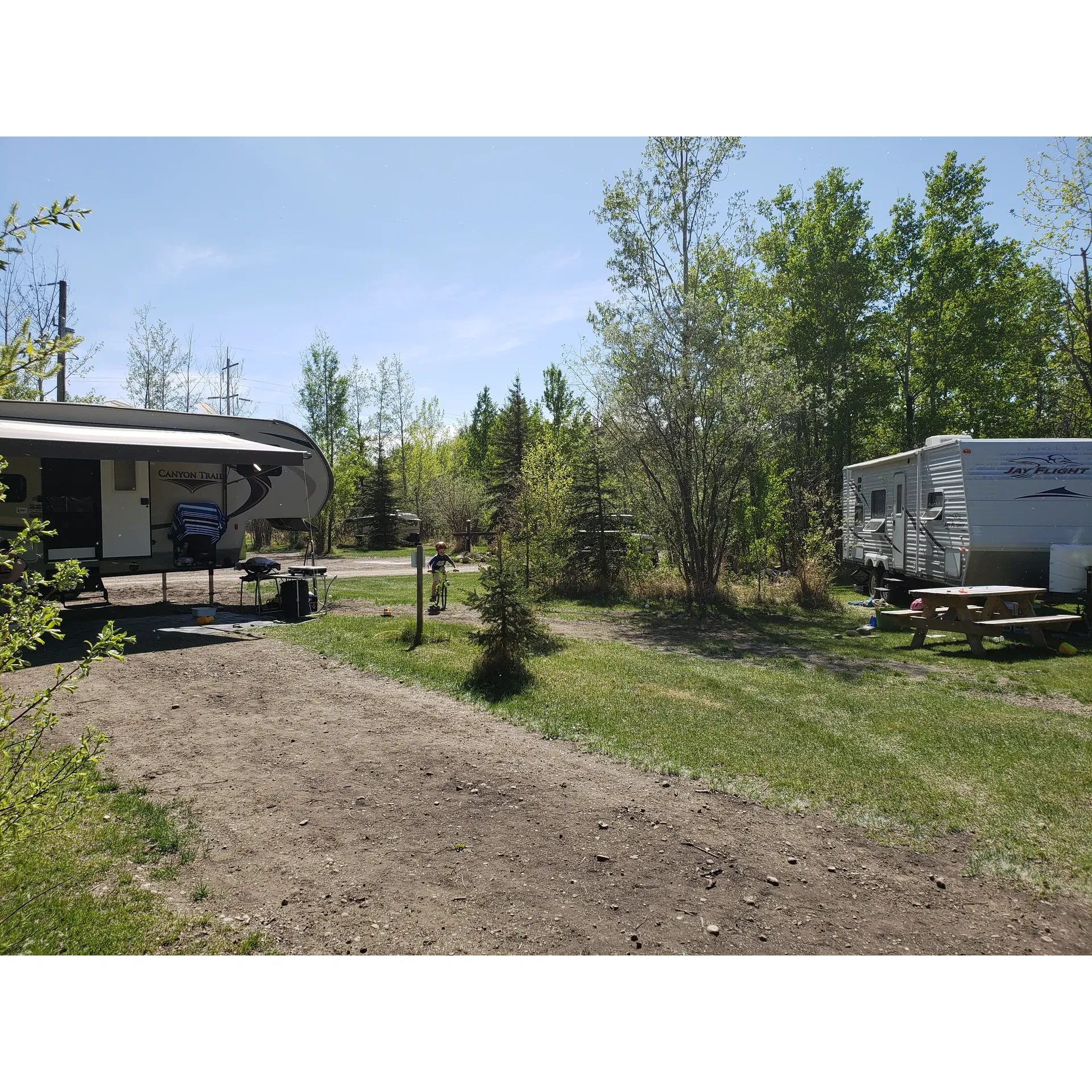 Entwistle RV Campground offers a harmonious blend of the traditional backcountry tent vibe and the conveniences of RV camping. Guests frequently express their joy and satisfaction with the picturesque and well-appointed campsites, which cater to both individual adventurers and larger groups. The grounds are well-praised for their tranquility and authentic camping experience, providing visitors with a serene escape just a stone's throw from Edmonton.

The campground's owner, Sandra, is often highlighted for her exemplary customer service, tending to guests with a personal touch that turns first-time visitors into returning guests. She is attentive and caring, especially appreciated during unexpected weather episodes, ensuring everyone's safety and comfort.

Accommodations at the campsite include spacious, clean sites, some of which are pull-throughs, making them convenient for a variety of camping setups. The provision of free firewood adds to the sense of welcome and preparedness the campground offers.

The amenities extend to well-maintained flush toilets, and guests celebrate the cleanliness and upkeep of the facilities. For those seeking group camping experiences, Entwistle provides power and water without additional reservation fees, making it a cost-effective option for larger parties.

The campground's proximity to Pembina River tubing and the local town's outdoor pool provides additional entertainment and relaxation activities. Moreover, guests appreciate the direct path available at the campground for launching their floats, underscoring the site's exceptional location.

The passionate efforts of the owners to develop and maintain a beautiful, accessible campsite are evident and widely appreciated. Whether guests are stopping over on a trip from Edmonton to Jasper or looking for a regular camping destination, the glowing reviews make it clear that Entwistle RV Campground is a treasure for both seasoned campers and new explorers. Description by ChatGPT.