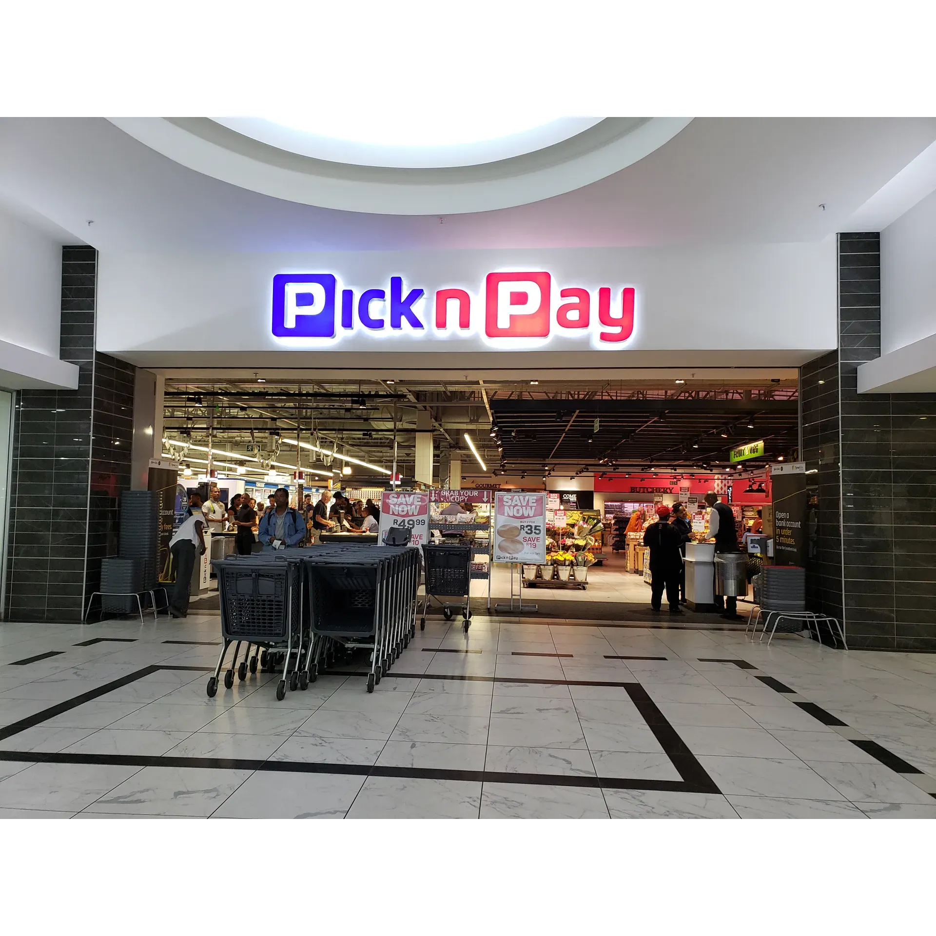 Located conveniently within the bustling Benmore Centre, Pick n Pay is renowned for its efficient and swift service, which makes the shopping experience exceptionally smooth for its clientele. Boasting a clean and modern environment reflecting the latest Pick n Pay design, this branch stands out for its inviting and well-maintained atmosphere.

Customers praise the exemplary service provided by the staff, highlighting the professional and knowledgeable associates, who not only meet but often exceed expectations. The commendable staff seems to be the store's pride, particularly individuals like Ntsiki, who has received glowing accolades for her outstanding service and professionalism.

The store offers a broad selection of products and takes pride in its ability to facilitate a quick and hassle-free shopping experience due to shorter queues compared to other locations. The well-organized environment and helpful, customer-focused team create a welcoming atmosphere for all who choose to shop there, making it a preferred destination for the local community's grocery and household needs.

Moreover, the seamless check-out process managed by the attentive cashiers at the kiosk exemplifies the store's dedication to customer satisfaction. Shoppers appreciate the initiative and problem-solving skills displayed by the staff, ensuring that any transaction is completed satisfactorily.

Pick n Pay in Benmore Centre is committed to providing a positive shopping experience, and consistently receives praise for its performance and quality of service, setting a benchmark for other stores in the area. Description by ChatGPT.