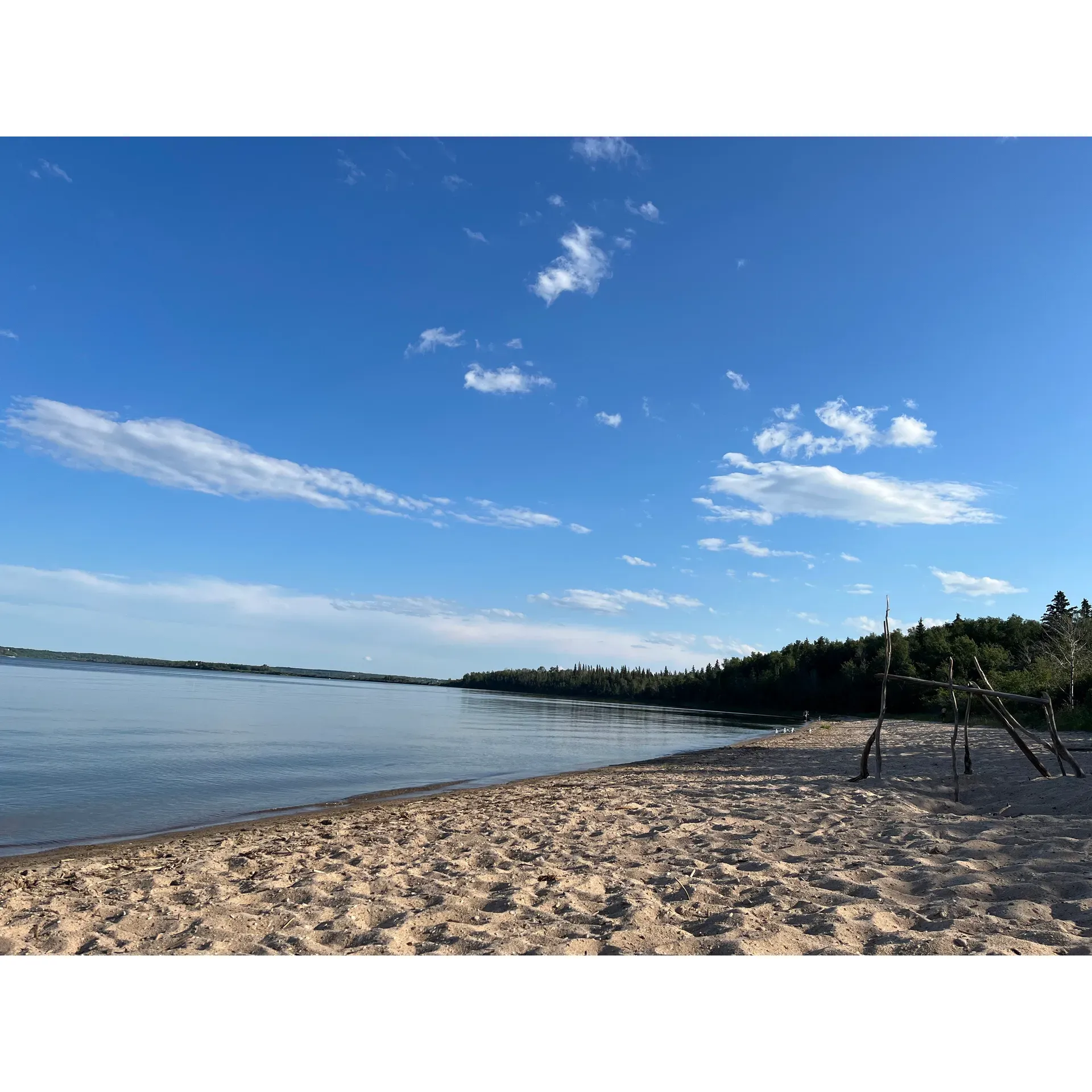 Sir Winston Churchill Provincial Park emerges as a breathtaking oasis in Alberta, providing an idyllic setting for nature enthusiasts and a sanctuary for wildlife. With the distinction of being the only provincial park situated on an island, it offers visitors a unique blend of old-growth forest serenity and aquatic adventure.

Spread your wings and explore the wonderful trails, which are reputed to be some of the best in the region, attracting avid hikers and nature lovers. The trails wind through the forest, offering a chance to immerse oneself in the calm and beauty of nature's splendor. Although there are many trails to choose from, each path promises an extraordinarily scenic experience that may lead you to see wildlife in their natural habitat.

If the allure of the water calls to you, bring along your kayak and take in the magnificent sights of the surrounding lake. Here, paddlers can find tranquility among the loons and mallards, and with a bit of luck, marvel at the majestic flight of bald eagles overhead. While exploring the lake's peaceful waters, the surrounding island scenery captivates with each stroke and provides a profound sense of connection to the wilderness.

For a perfect end to your day, the park offers large and private waterfront sites where one can relax by a crackling campfire under a canopy of stars, facilitated by the park's designation as a dark sky preserve. Enjoy the enchanting symphony of waves meeting the shoreline, making for truly magical evenings.

In terms of amenities, the park ensures a comfortable stay with clean outhouses, sizable campsites, and firewood provisions at a reasonable rate. This well-equipped park also features powered sites and enriching amenities such as showers, laundry facilities, and a quaint store for essentials.

For families, the park offers two playgrounds and the best day-use picnic area, along with sandy beaches that are a delight in early summer. As seasons shift, the park transitions into a winter wonderland, presenting excellent cross-country ski trails and opportunities for ice fishing.

Sir Winston Churchill Provincial Park stands out as an exceptional destination for its natural offerings, recreational activities, and commitment to providing an enjoyable experience to all who visit. Whether you’re seeking solitude, adventure, or a family getaway, this is a park that promises endless wonders with every visit. Description by ChatGPT.