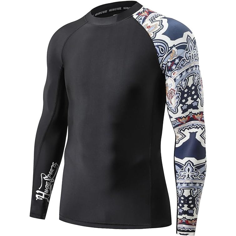 The HUGE SPORTS Men's Splice UV Sun Protection UPF 50+ Skins Rash Guard is designed to provide maximum protection from the sun's harmful ultraviolet (UV) rays. With a UPF rating of 50+, this rash guard effectively blocks out 98% of UVA and UVB rays, helping to prevent sunburn and skin damage during outdoor activities.