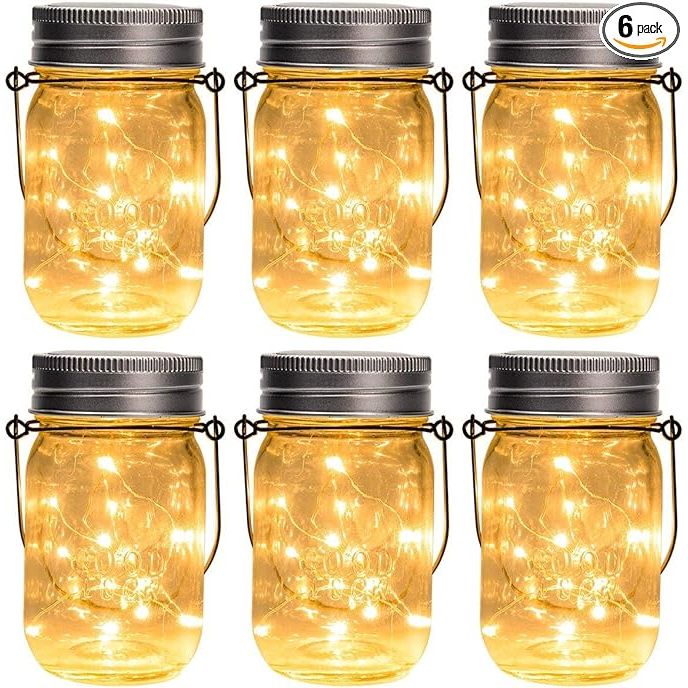 The GIGALUMI Hanging Solar Mason Jar Lights are a set of 6 hanging solar lanterns that come with 30 LED string fairy lights. These lights are designed to add a charming and whimsical touch to any outdoor space, such as gardens, patios, and wedding venues.