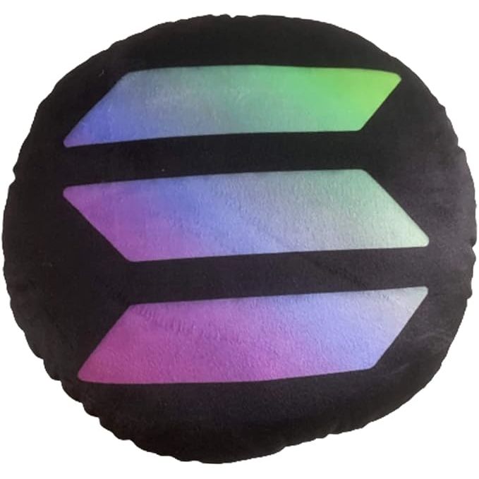 The Solana Pillow is a round stuffed plush pillow designed by BlockCraft.Shop. The pillow features the logo of Solana, a popular cryptocurrency platform known for its fast and secure transactions. The pillow is made of soft, plush material, making it comfortable to use for lounging or decoration.