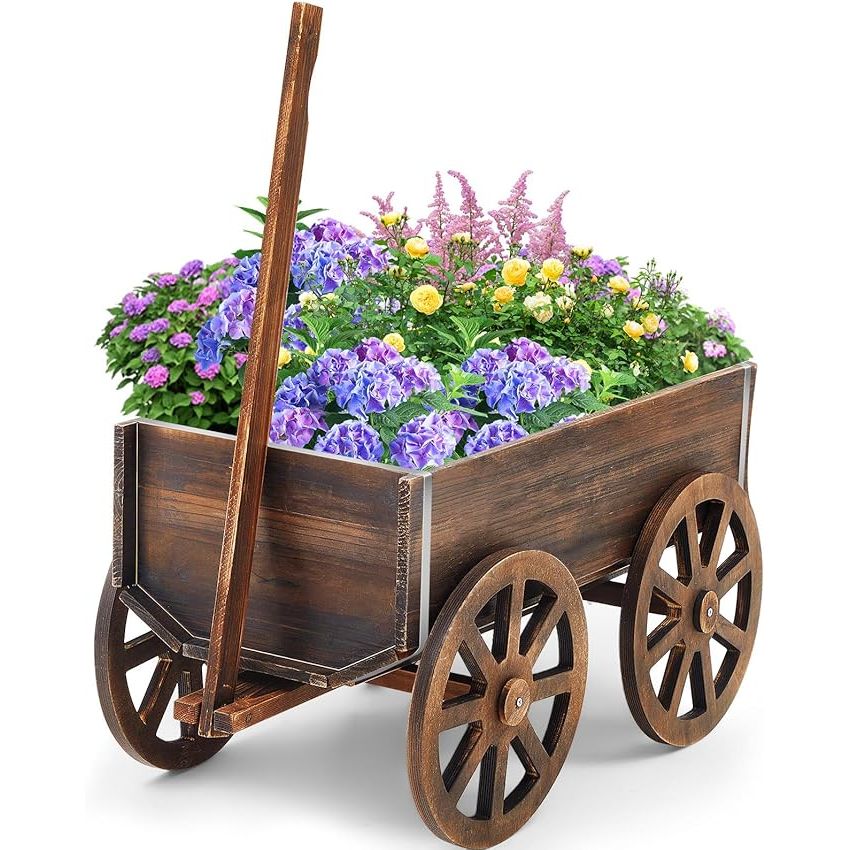 The Wooden Wagon Planter Box is a charming and versatile addition to any garden or outdoor space. This decorative planter features a classic wagon wheel design that adds a touch of rustic flair to your patio, garden, or balcony. The planter box is made of durable wood that is perfect for holding a variety of flowers, herbs, and vegetables.