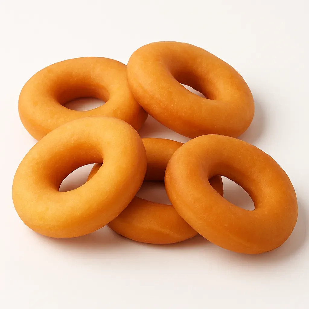 Beignes, or Quebec-style doughnuts, are a delectable French-Canadian treat that are reminiscent of the classic American doughnut, yet carry a unique touch from the Quebec region. They are typically made from a sweet, yeast-risen dough that's rolled out, cut into various shapes, and then deep-fried until golden brown.