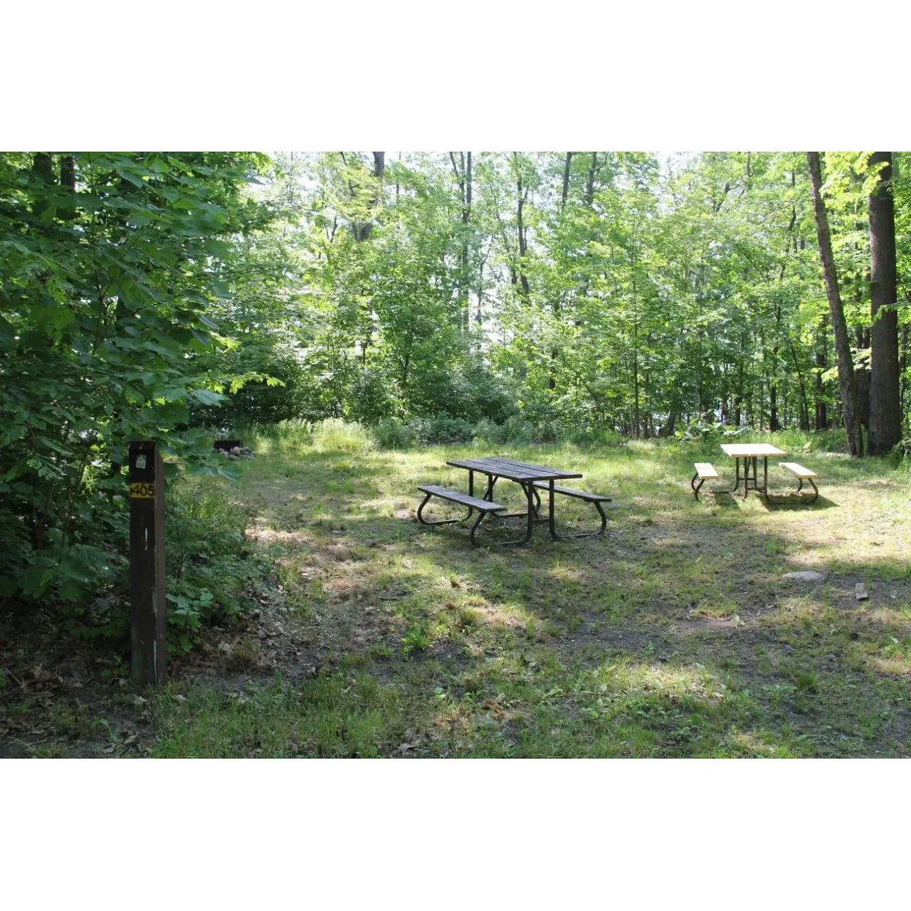 Lighthouse Point B Campground offers an idyllic escape for outdoor enthusiasts seeking tranquility and the beauty of lakeside camping without the bustle of beachside activities. The serene environment provides an opportunity for campers to unwind in a calm, relaxing setting, enveloped by the soothing sounds of nature and the gentle lapping of lake waters.

The scenery at Lighthouse Point B Campground is picturesque, with each campsite offering unique and breathtaking views of the expansive lake, complemented by the lush nearby greenery. Visitors are often enamored by the sunrise and sunset vistas that can be enjoyed directly from their campsites – perfect for photographers and nature lovers alike.

Outdoor adventures are aplenty, with the campground serving as an excellent base for fishing enthusiasts looking to cast their lines into the bountiful lake waters. The surrounding area is also a hiker's paradise, with numerous trails that meander through the local flora and fauna, allowing hikers to fully immerse themselves in the splendor of the natural environment.

The campground facilities cater to a variety of needs, ensuring a comfortable stay for all guests. Each camping spot is spaciously laid out, offering plenty of room for setting up tents or parking RVs, and comes with essential amenities to enhance the camping experience.

The atmosphere at Lighthouse Point B Campground is described as peaceful and laid-back, making it a preferred choice for those seeking to disconnect from the daily grind and reconnect with nature. It's a place where the tranquility of the surroundings fosters relaxation and where visitors can enjoy the simple pleasures of the great outdoors without the distractions of more crowded tourist-centric locations.

For those who seek to complement their stay with a refreshing dip, the campground's proximity to neighboring facilities with safe swimming areas provides a convenient option for a day trip. Thus, Lighthouse Point B Campground remains a cherished spot for visitors seeking a peaceful retreat with the allure of lakeside camping and the splendor of the wilderness at their doorstep. Description by ChatGPT.