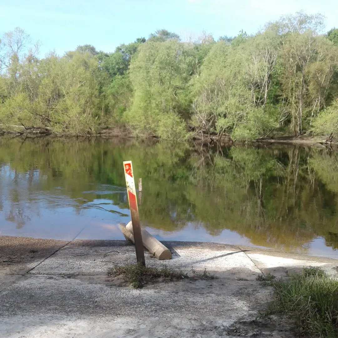 Piney Creek Landing Campground offers a serene escape for outdoor enthusiasts and anglers. Visitors delight in the picturesque environment, engaging in peaceful fishing excursions along the creek's bank. Embraced by majestic pine trees, the campground provides a tranquil retreat from the hustle of daily life, allowing guests to bask in the quietude of nature. Boasting well-maintained access roads and the charm of a remote hideaway, this destination is a treasure for those seeking simplicity and beauty in their outdoor adventures. Though it stands as a basic campground, the raw allure of Piney Creek Landing is undeniable, offering guests a chance to reconnect with nature and indulge in the undisturbed surroundings, including the option of riverside camping—a perfect backdrop for those who appreciate the bare essentials of camping under a canopy of green. With its lush scenery and complimentary camping spots, Piney Creek Landing Campground is praised as a top choice for those in pursuit of an uncomplicated and serene outdoor experience. Description by ChatGPT.