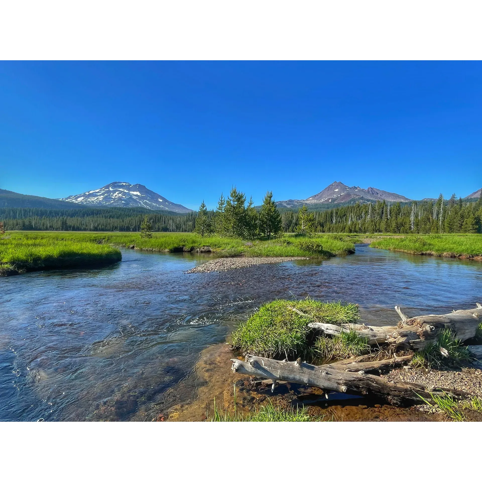 Soda Creek Campground is a picturesque outdoor retreat, offering an escape into nature with unparalleled views of the South Sister and Broken Top mountains. With the serene South Sister mountain range as its backdrop, the campsite provides spectacular sights right from your tent, including the mesmerizing alpenglow at dawn. A small river meanders through the landscape adding to the tranquil ambiance of the area.

This campground is an idyllic destination for adventurers and families alike, offering great access to Sparks Lake and a plethora of local trails that beckon hikers, nature enthusiasts, and those seeking a tranquil getaway. The prime location makes it the perfect base camp for hiking South Sister and exploring the impressive Three Sisters Wilderness.

Privacy is a valued feature at Soda Creek Campground, with its limited number of campsites ensuring an intimate and secluded experience for each group of campers. The peaceful setting is enhanced by the beautiful creek flowing through and the local wildlife that can be spotted wandering nearby, providing an authentic wilderness experience.

Family and dog-friendly, the campground exudes a welcoming atmosphere that can be enjoyed by all visitors. It is a well-loved site along the Cascade Lakes Highway, known for its amazing views, especially the perspective it offers of the Sisters and the back of Mt. Bachelor.

With sites in demand due to their popularity and stunning location, early reservations or arrival is recommended for those looking to secure a spot in this exceptional natural haven. Whether you're waking up to the gentle flow of the creek or preparing for a day of hiking in the wilderness, Soda Creek Campground promises a memorable outdoor experience surrounded by the beauty of the Oregonian landscapes. Description by ChatGPT.