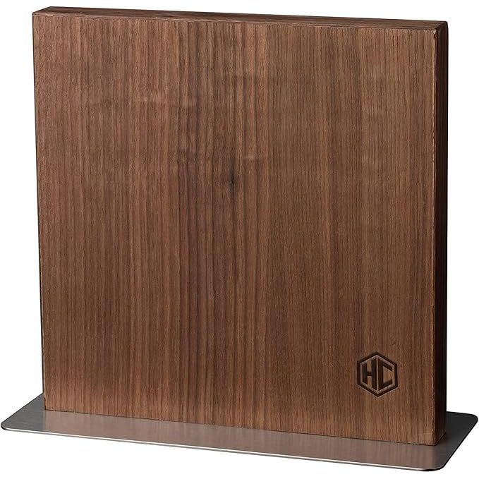 The HexClad Magnetic Walnut Knife Block Holder is a versatile storage solution for your kitchen tools. Made from high-quality walnut wood, this knife block features strong enhanced magnets that securely hold knives, shears, and other steel utensils in place.